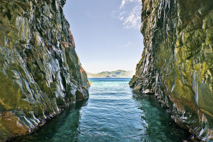 Ajaccio/Porticcio: Scandola Nature Reserve Guided Boat Tour - Calanques de Piana: close-up red granite drama