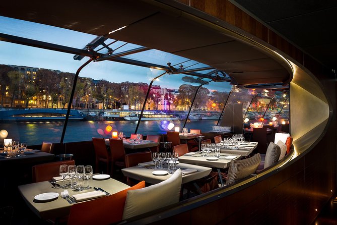 Bateaux Parisiens Seine River Gourmet Dinner & Sightseeing Cruise - Stepping onto the open-air deck for photos