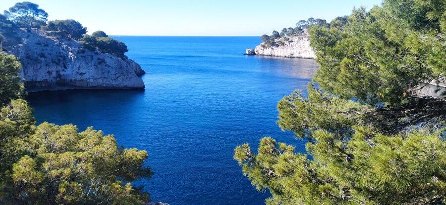 Cassis: 3 Calanques Half-Day Hiking Tour with Swimming - Calanque de Port-Miou: the 1400 m start with marina views and underground surprises