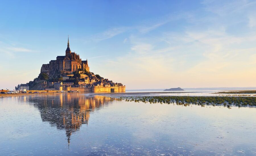 From Bayeux: Full-Day Mont Saint-Michel Tour - Entering the Mont Saint-Michel Abbey, where time stacks up