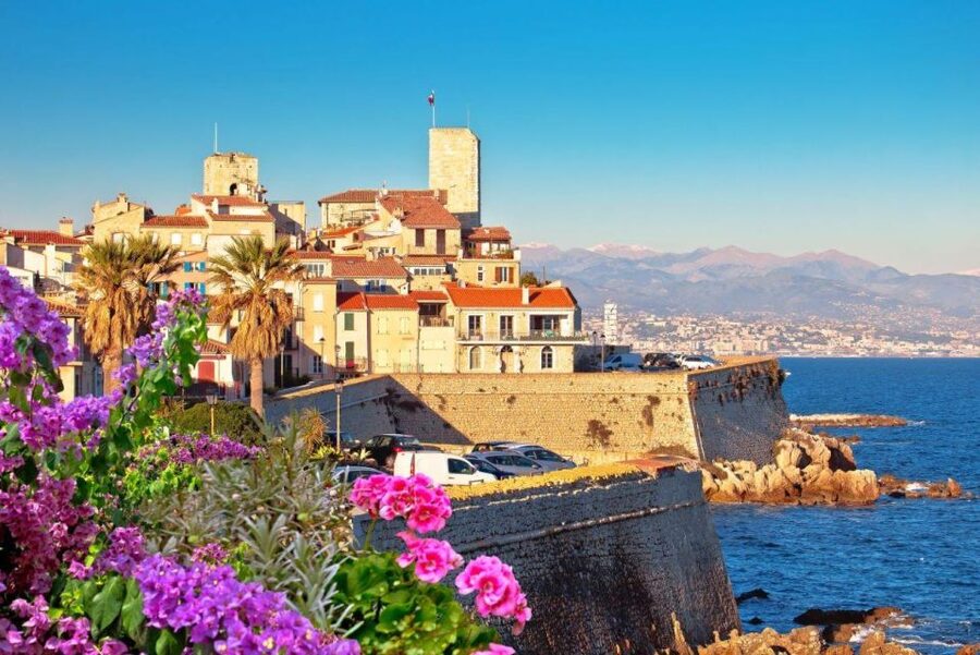 From Nice: Cannes, Antibes & St Paul de Vence Half-Day Tour - Antibes: old town streets, markets, and Port Vauban luxury yachts