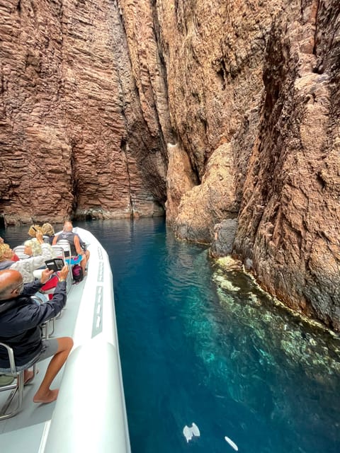 From Sagone/Cargèse: Scandola and Calanques de Piana Cruise - Listening on the water: guides, audio, and language expectations