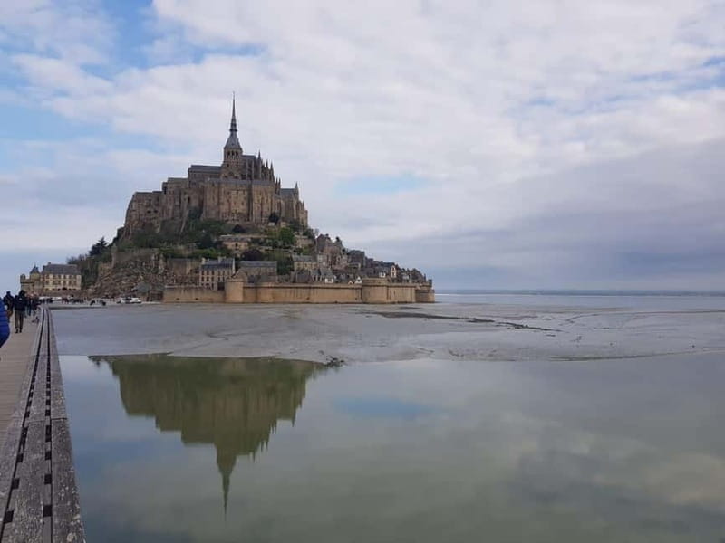 Mont Saint Michel: Village History and Legends Walking Tour - Getting there the easy way: bridge walk or free shuttle
