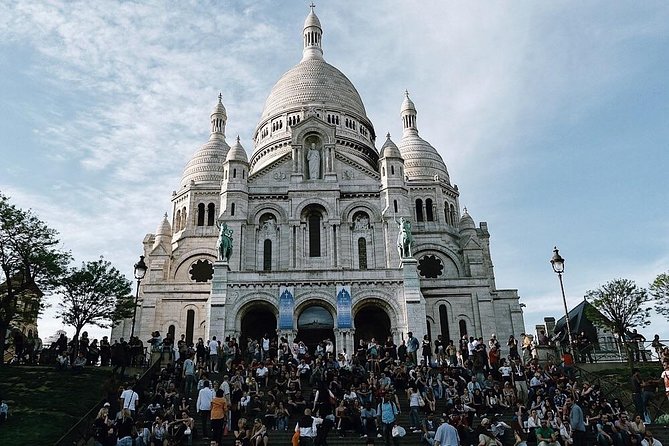 Montmartre District and Sacre Coeur - Exclusive Guided Walking Tour - The Moulin Rouge to Rue Lepic stretch: theater and artists in the same breath
