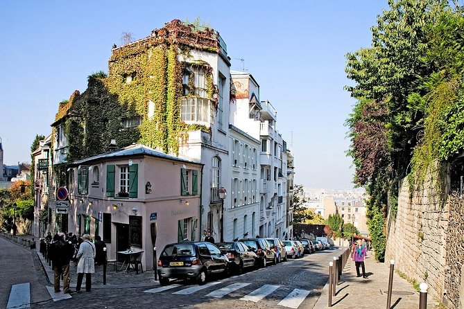 Montmartre Hidden Gems and Scenic Highlights Walking Tour - Moulin de la Galette: A Windmill Photo Moment with Context