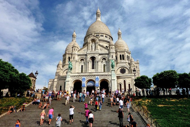 Montmartre Hidden Gems and Scenic Highlights Walking Tour - The Surreal Nudge: Man Walking Through a Wall