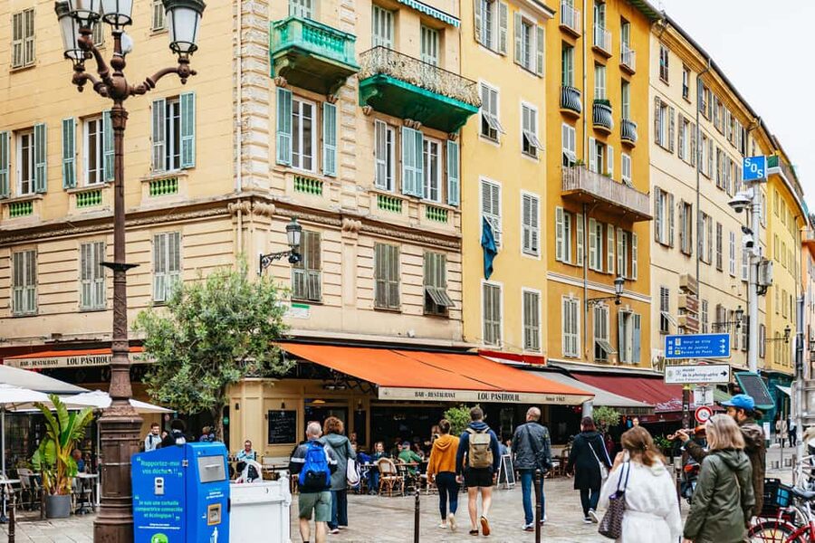 Nice: Sunset Food Tour with Full Meal and Wine - Stop-by-stop: chocolate, olive oil, socca, pissaladière, and ice cream