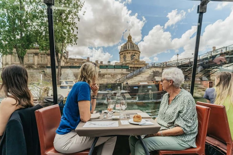 Paris: 2-Hour River Seine Lunch Cruise with 3-course-menu - Inside the glass-canopy boat, what the vibe is really like