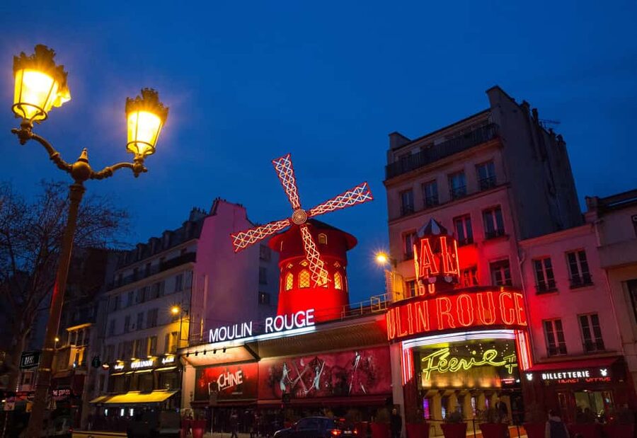 Paris: First Show Moulin Rouge with Champagne & Seine Cruise - The Féerie Revue: Can-Can Energy, 100 Performers, and Stage Spectacle