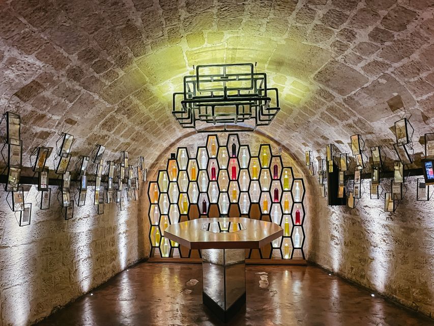 Paris: Les Caves du Louvre Guided Tour with Wine Tastings - Entering the 18th-century wine cellars beside the Louvre