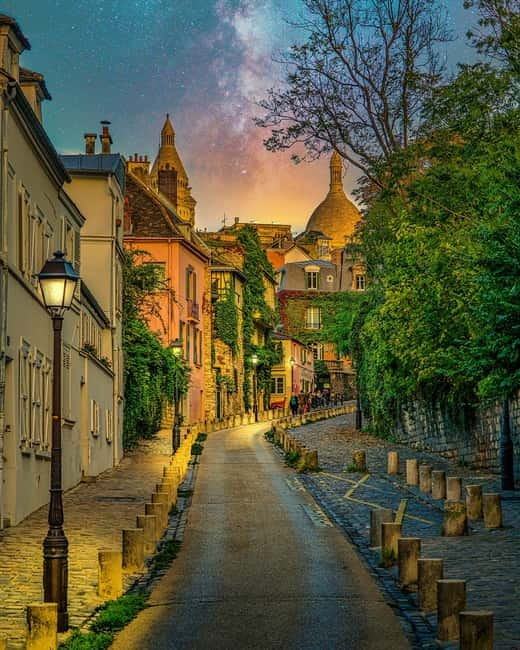 Paris: Montmartre Highlights Walking Tour with a Local Guide - Moulin de la Galette: A Windmill Icon and a Photo Moment