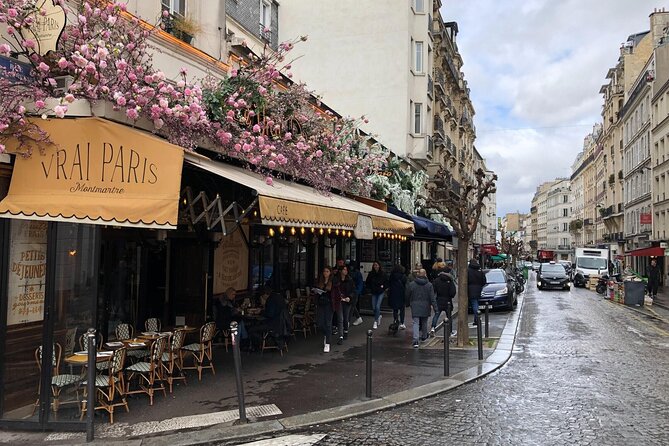Paris Montmartre Private Walking Tour - Best Art, Culture, Food - Place du Tertre: Street Artists, Caricaturists, and a Smart Place to Hang Out