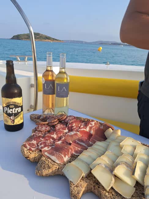 Porto-Vecchio : Sunset Cruise & Apéritif - Sunset in the captain’s quiet cove, with mountains in view