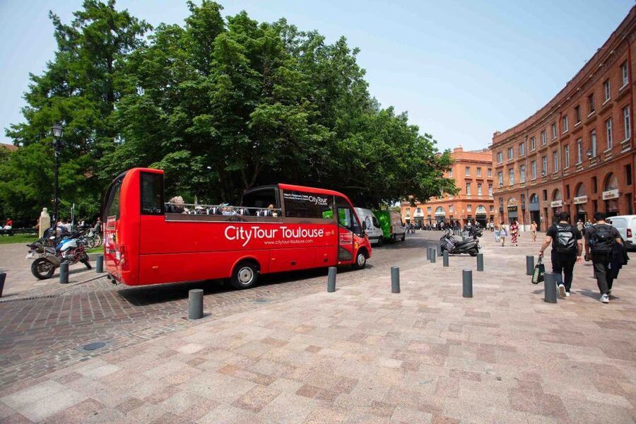 Toulouse: City Sightseeing Tour by Bus with Audio Guide - What to watch for: narration sync and seat sightlines