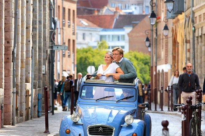 Unique Tour of Lille by Convertible 2CV - 1h00 - Guide style: witty storytelling, fast pacing, and how to get great photos